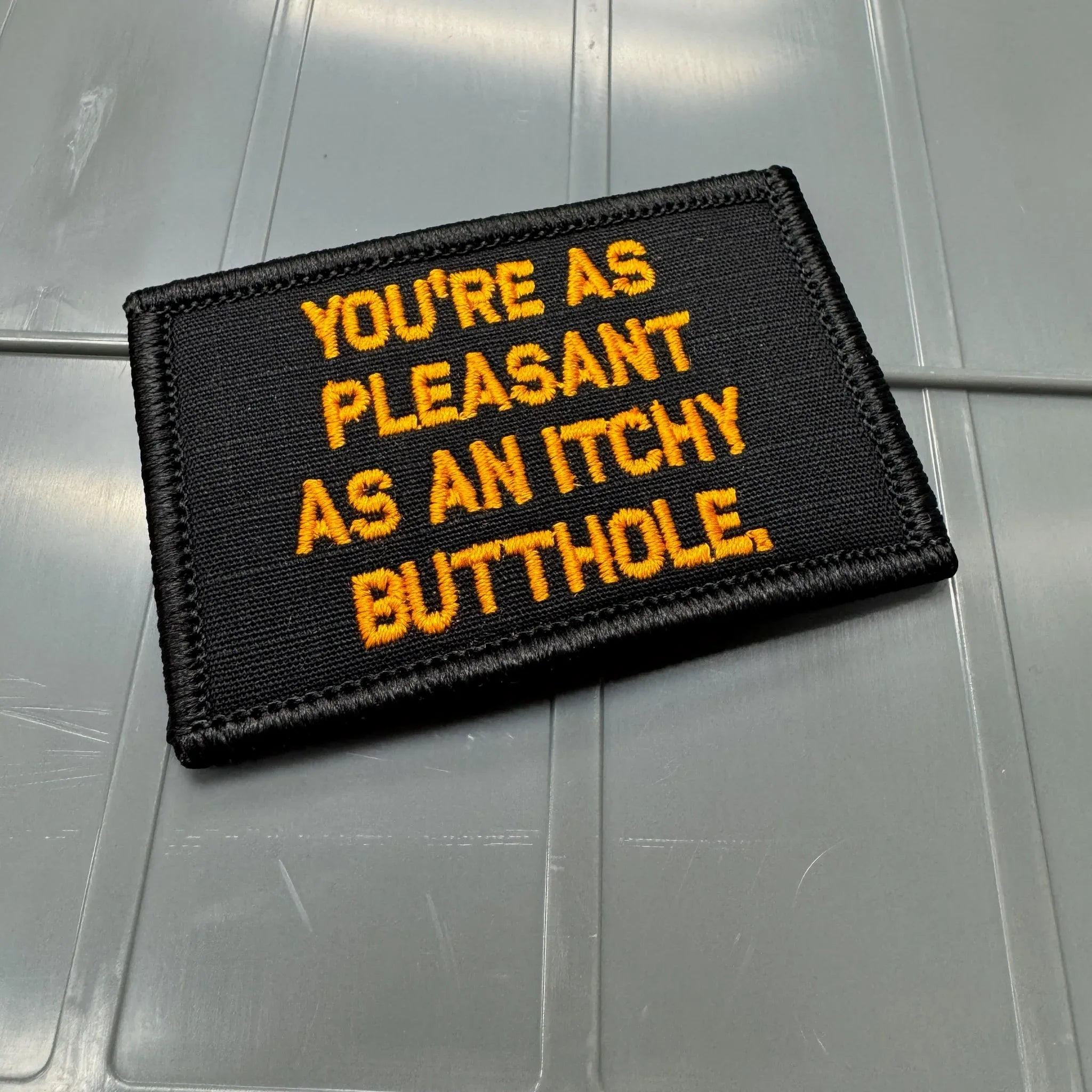 As Seen on Socials - You're As Pleasant As An Itchy Butthole - Black w/Orange